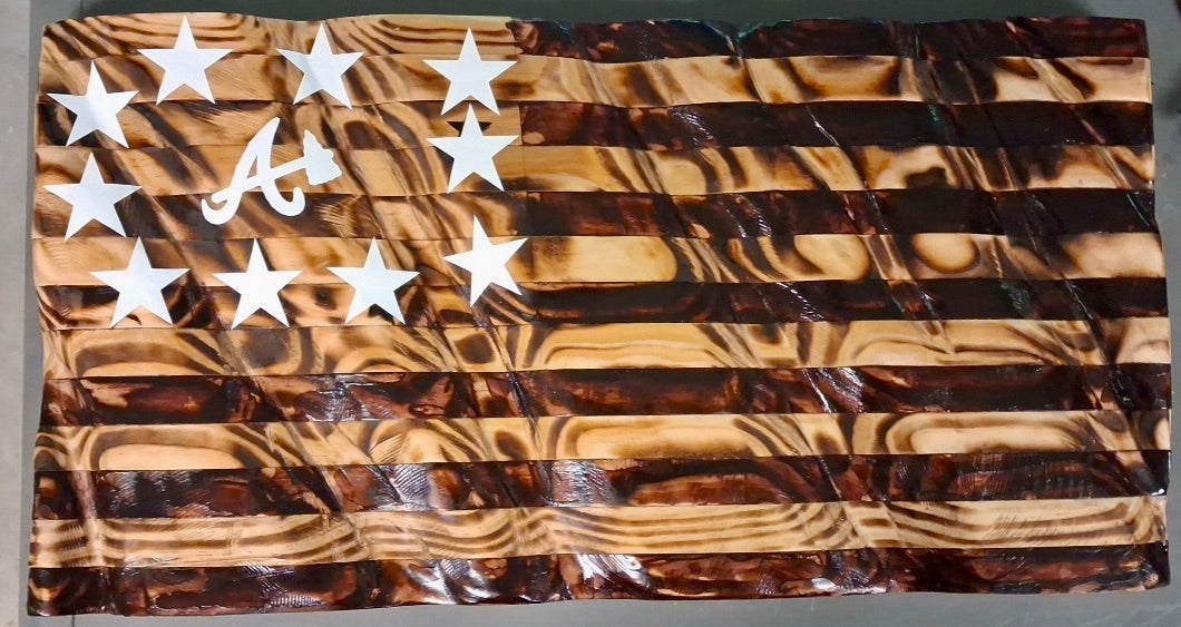 Custom torched waving wooden American flag with Atlanta Braves logo in canton and hand-cut white stars