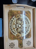 Custom resin prep board with gold resin pour and personalized tavern logo on solid wood
