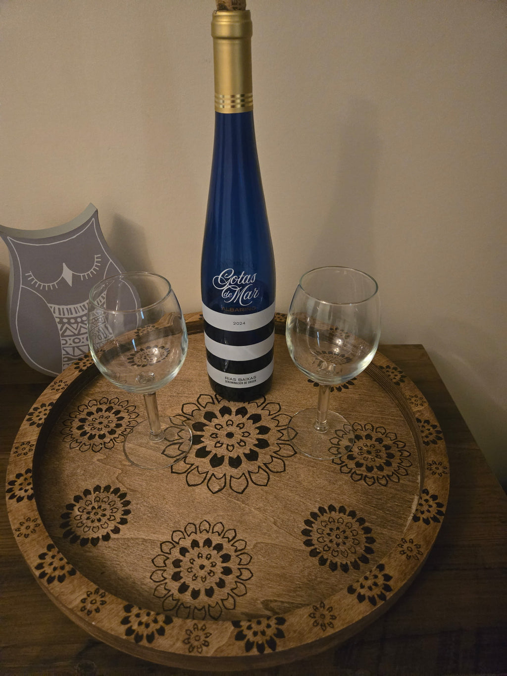 Custom wood burned wine serving tray with mandala design, styled with wine bottle and glasses