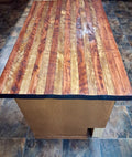 Hand cut stained and sealed rustic kitchen island top with rich wood grain and deep blue resin edge detail