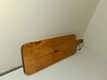 Handmade rustic paddle-style charcuterie serving board with leather cord loop on handle