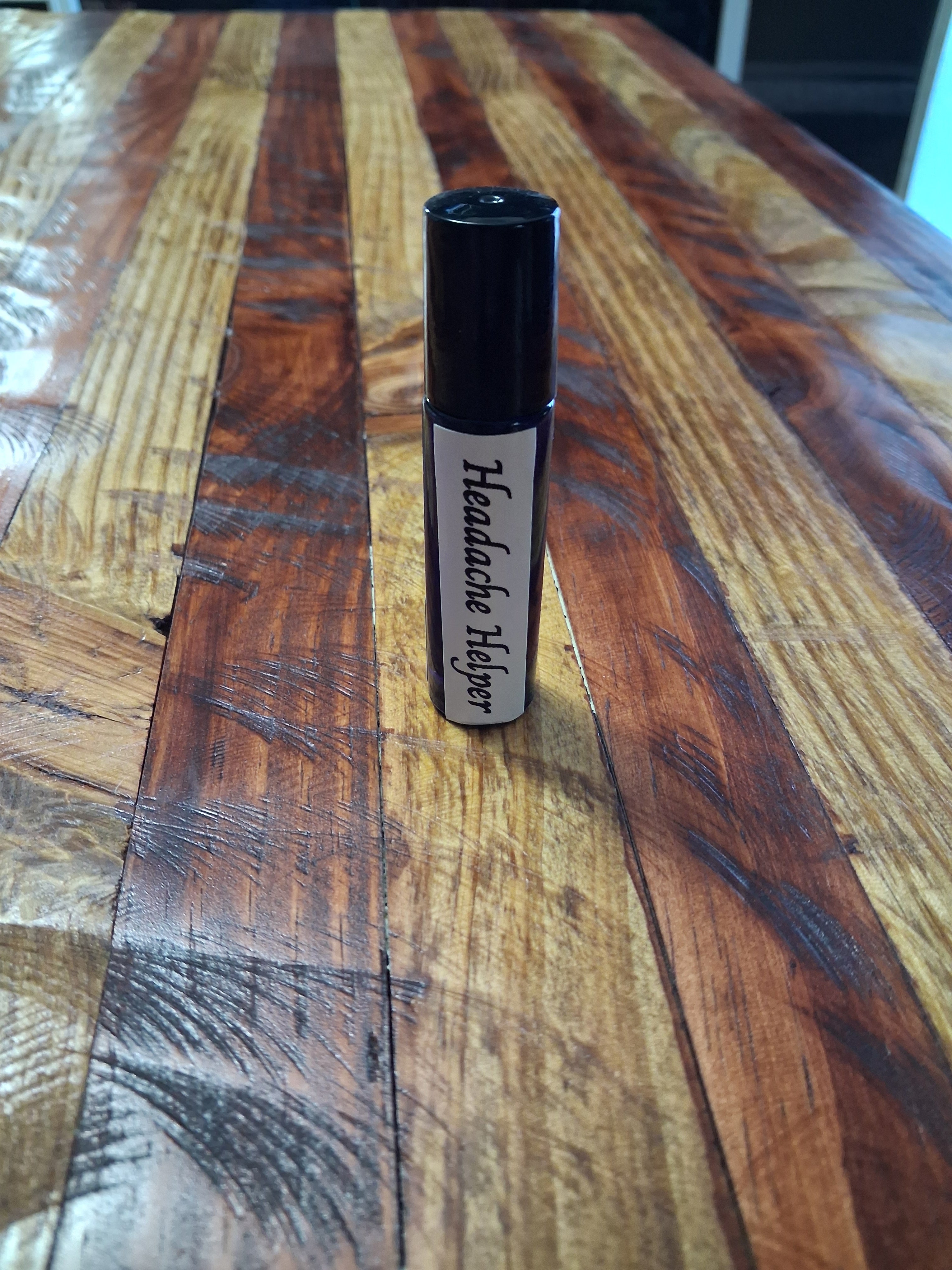 Headache Helper Roll-On 2oz standing upright